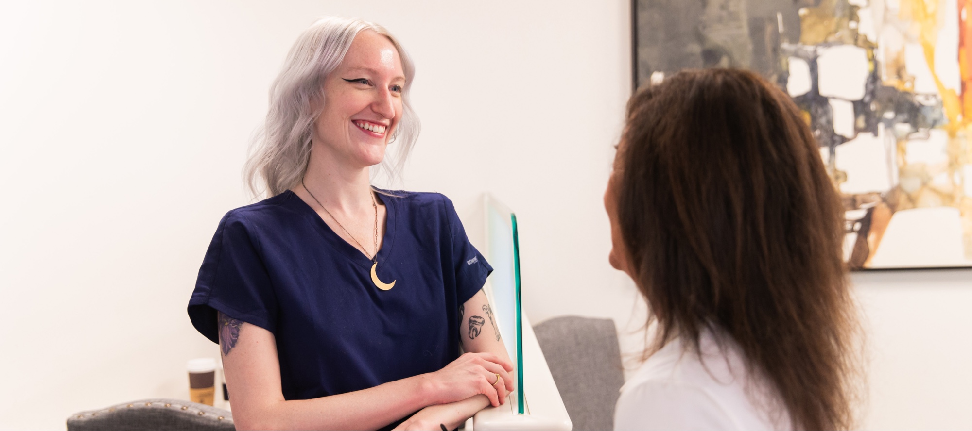 team member and patient smiling