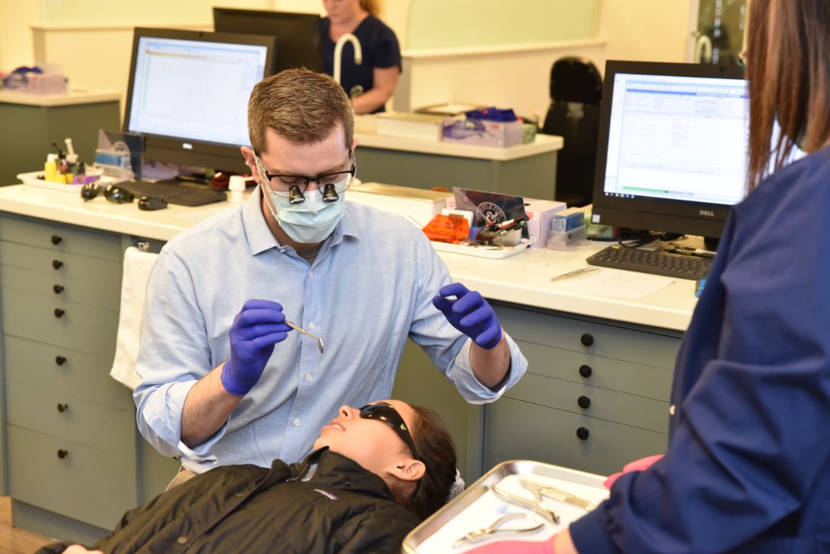 Dr. Brady working on a patient's teeth